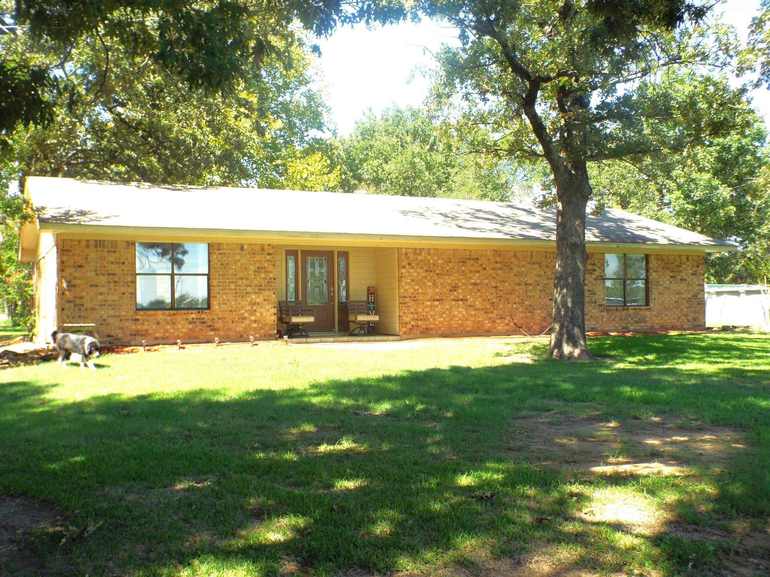 Home with acreage in Powderly || Century 21-Harvey Properties