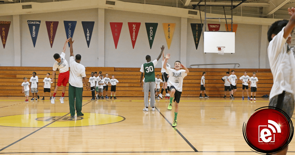 Campers are shown engaged in drills in a previous basketball camp held at Paris Junior College.